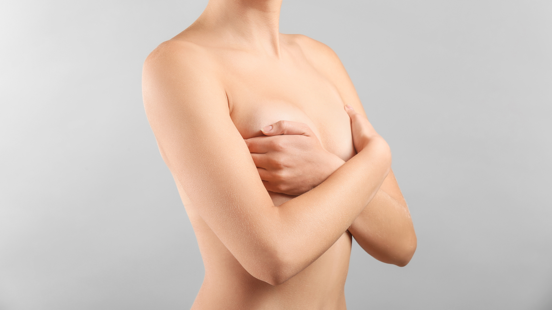 a woman showing her breast assymetry | Physician's Institute